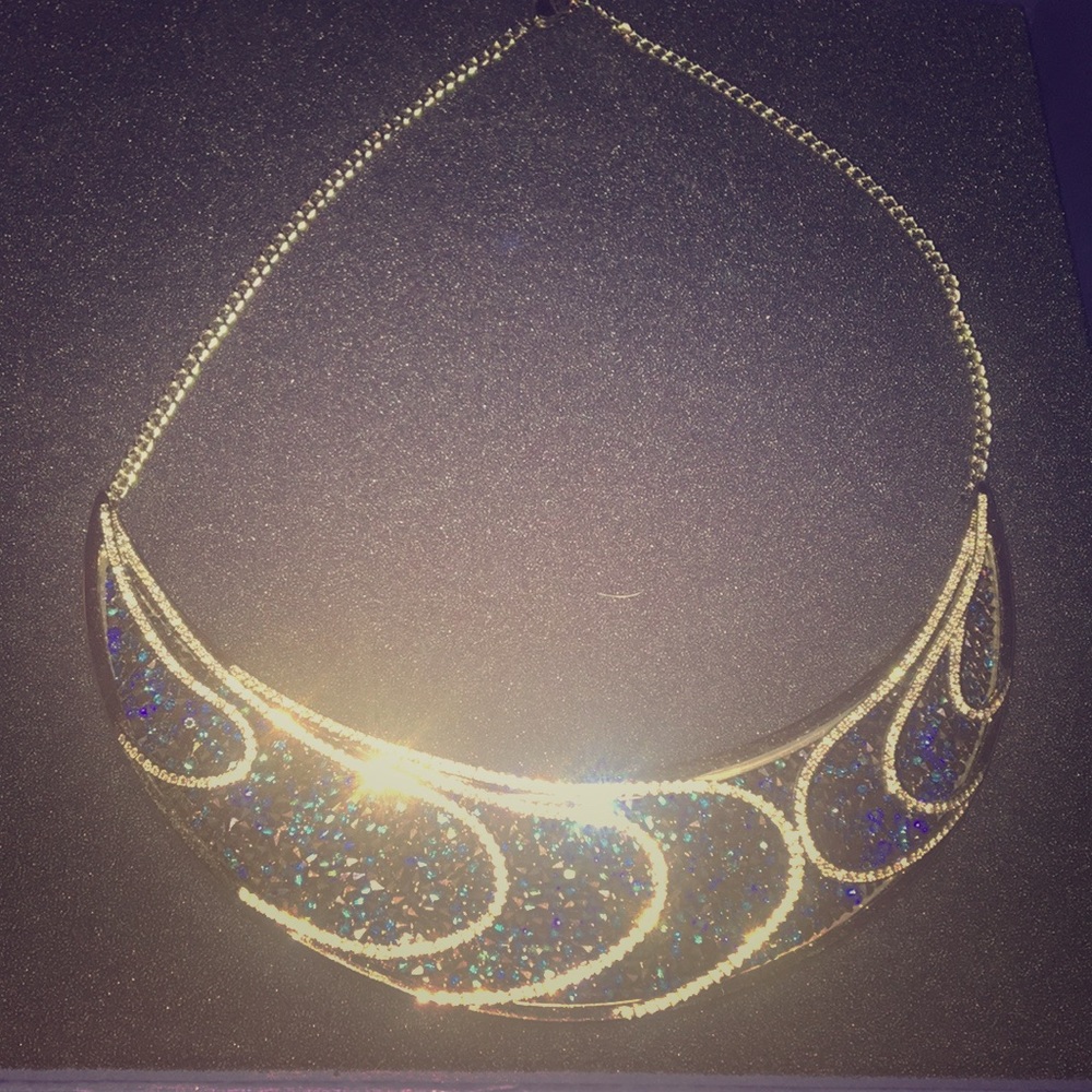 Swarovski necklace with blue stone detailing.